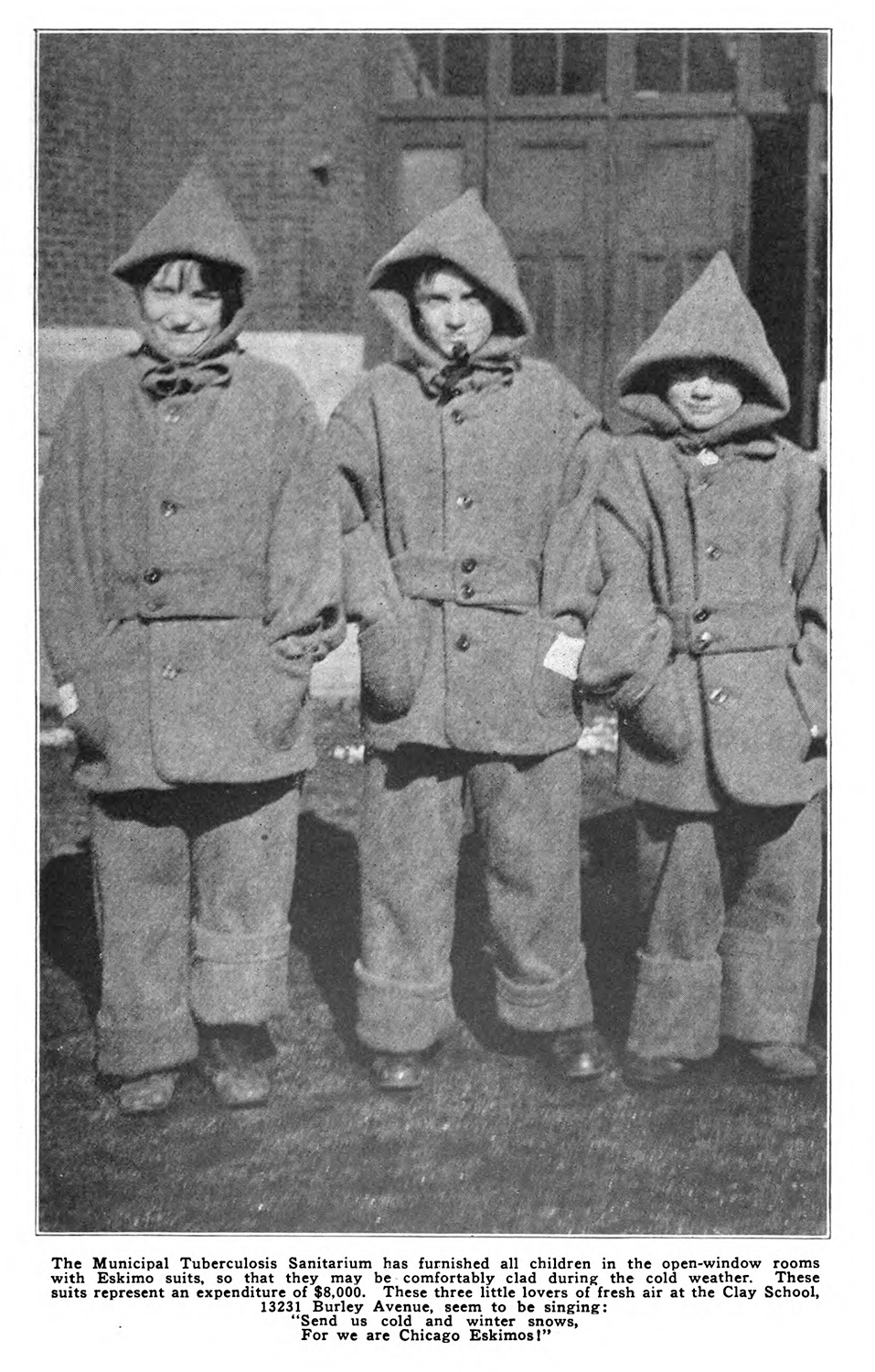 Three students in their heavy coats posing for a picture.